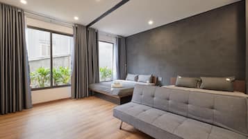 Family Room, Non Smoking, City View | Minibar, desk, laptop workspace, blackout drapes