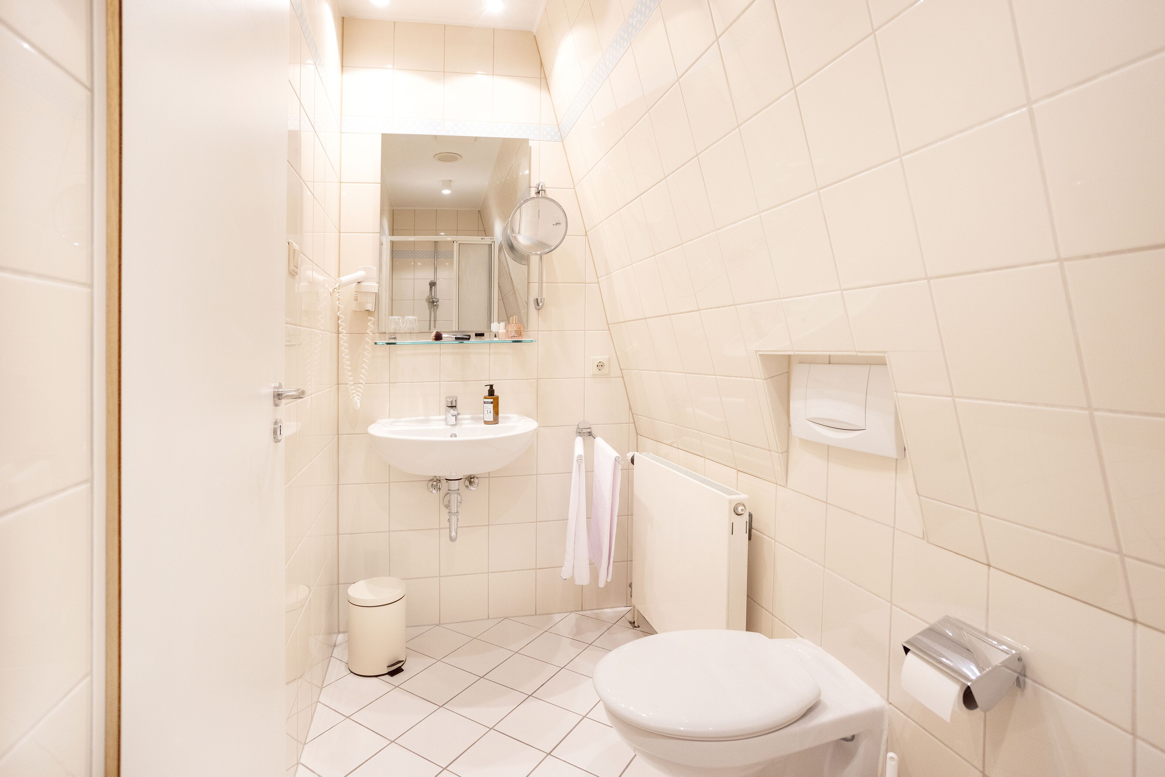 deluxe apartment | bathroom | shower, hair dryer, towels, soap