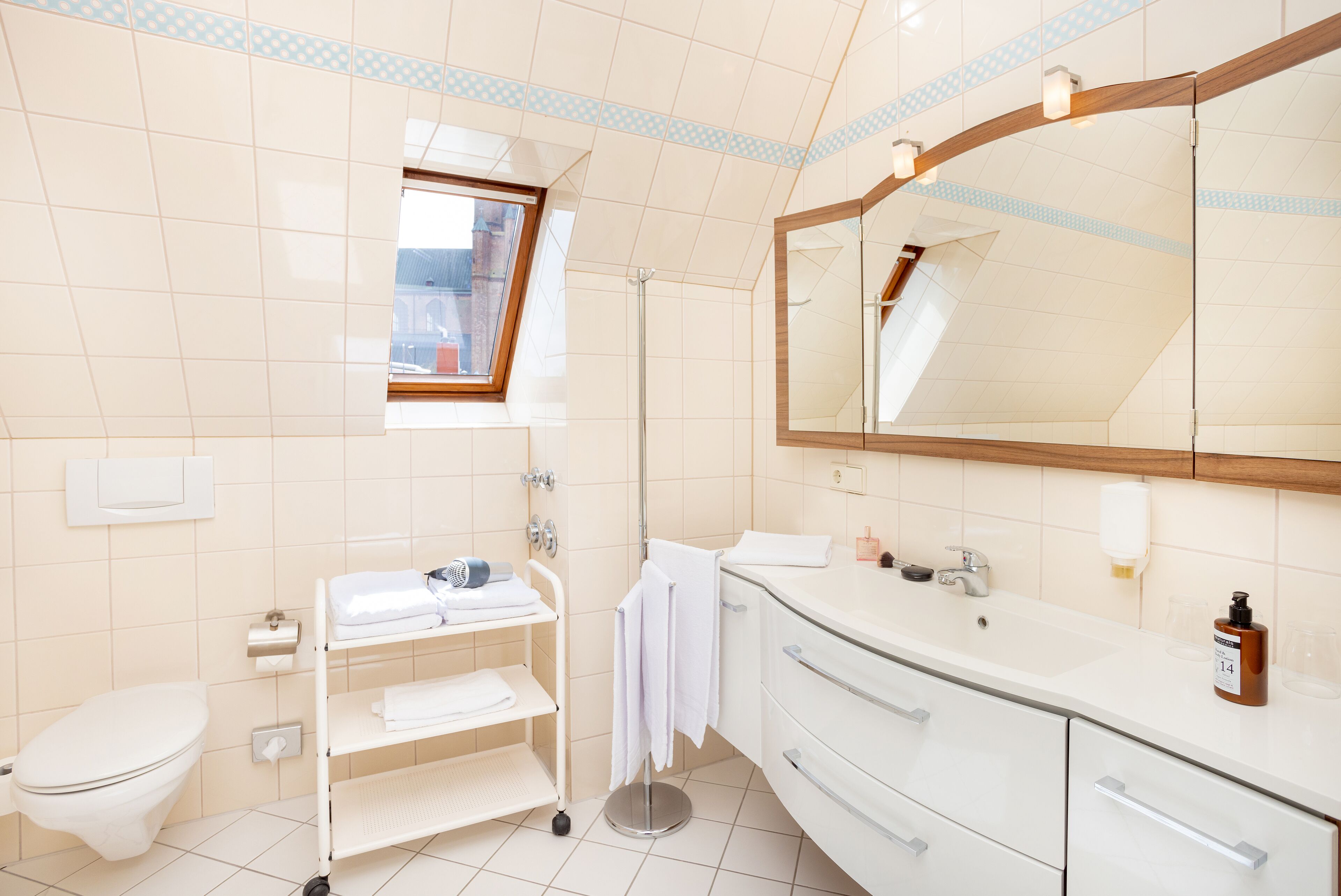 deluxe apartment | bathroom | shower, hair dryer, towels, soap