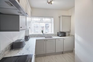 Apartment | Private kitchen | Full-size fridge, microwave, oven, stovetop
