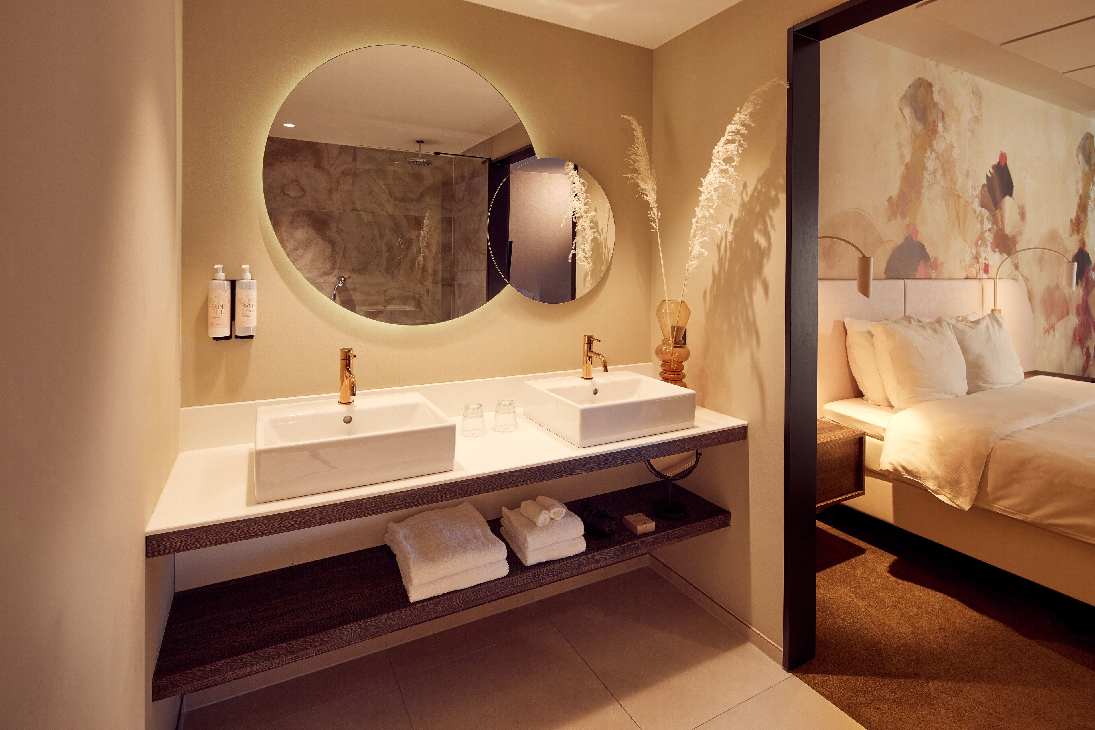 suite | bathroom | hair dryer, towels, soap, shampoo