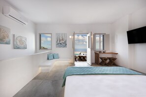 Panoramic Studio Suite, 1 King Bed, Jetted Tub, Sea View | Living area | 43-inch Smart TV with digital channels, TV - San Martino cave villas (Santorini)