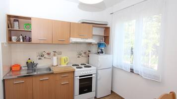 Apartment, 1 Double Bed, Balcony | Private kitchen | Fridge, stovetop, cookware/dishes/utensils, freezer