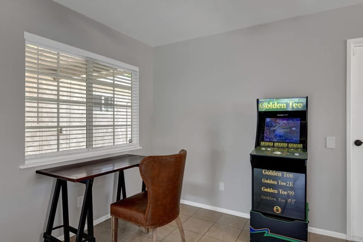 Golden Tee Video Game and Desk for remote working.
