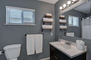 Bathtub, hair dryer, towels