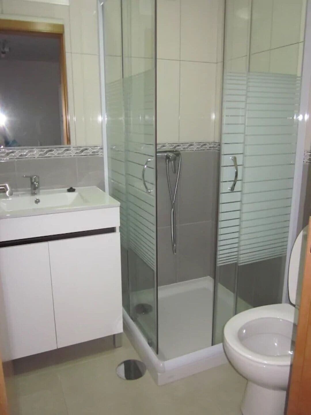 Shower, hair dryer, towels, toilet paper