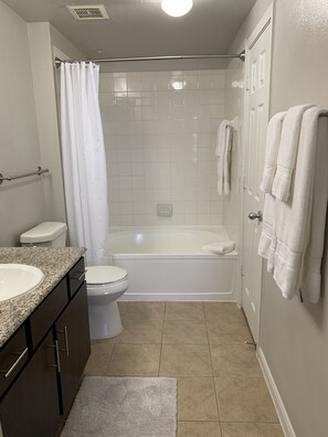 Hair dryer, towels, soap, shampoo