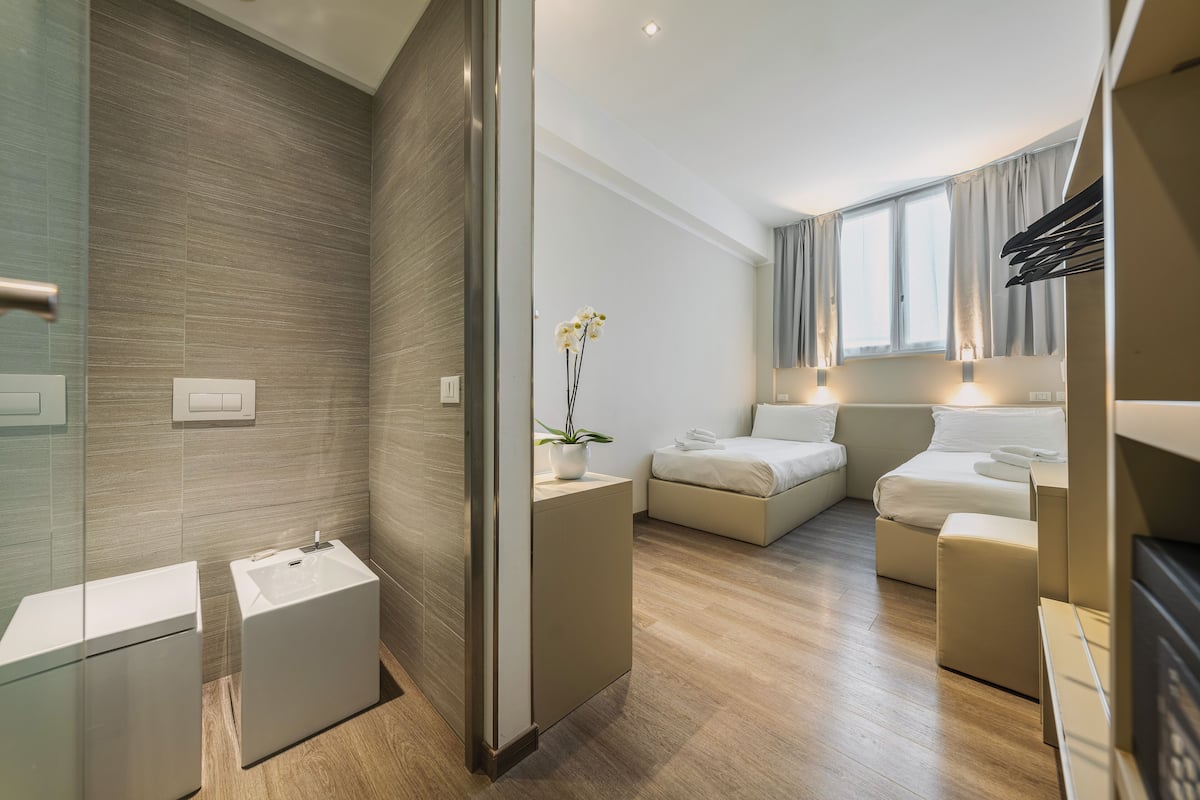 double or twin room | in-room safe, desk, laptop workspace, blackout curtains