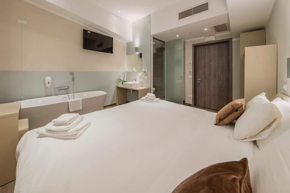 comfort double or twin room | in-room safe, desk, laptop workspace, blackout curtains