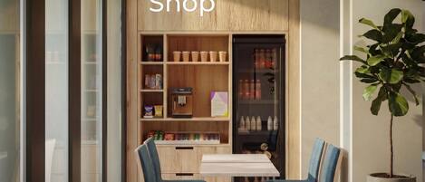 A shop area with wooden shelving, a coffee machine, and seating.