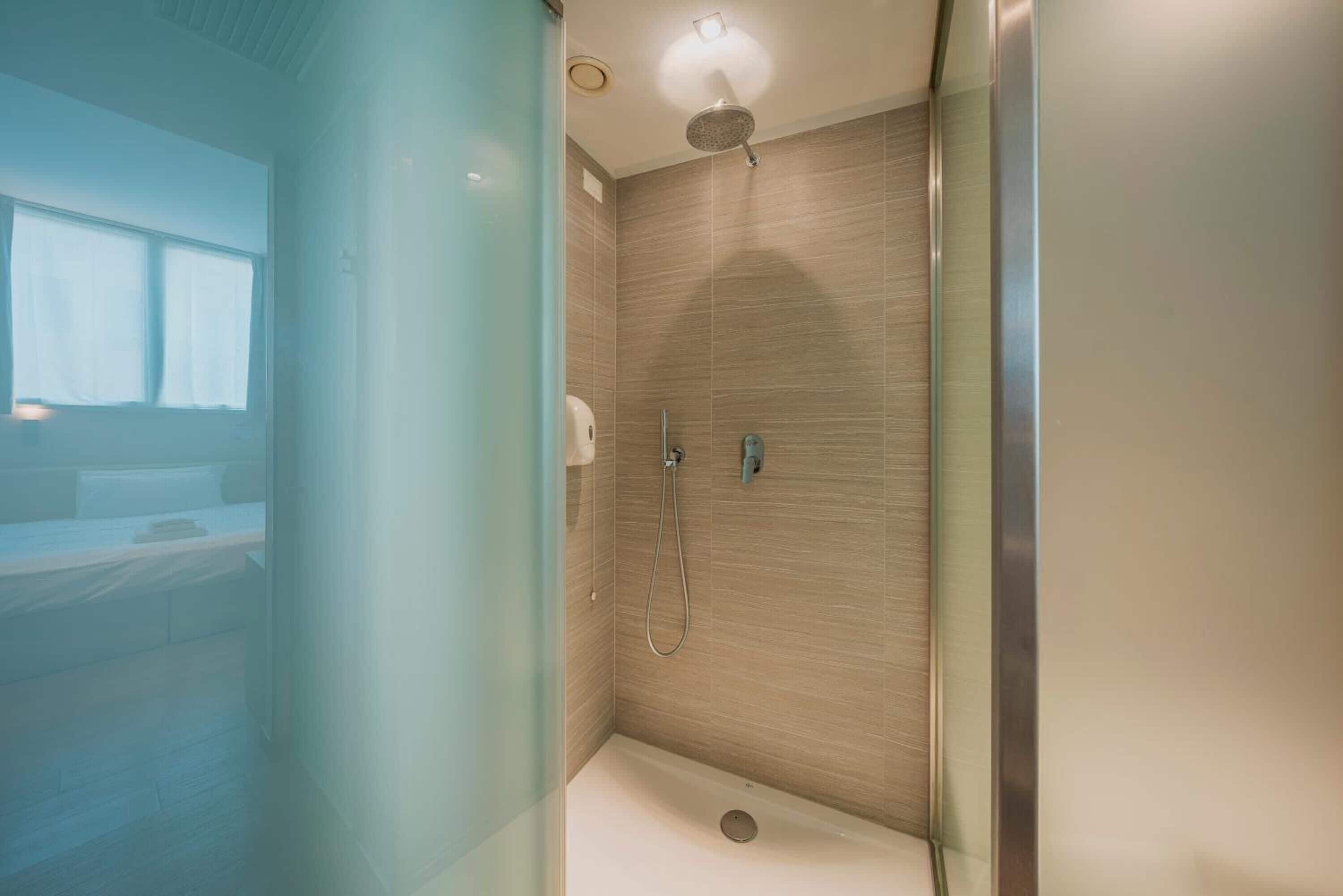 comfort double or twin room | bathroom | shower, rainfall showerhead, hair dryer, towels