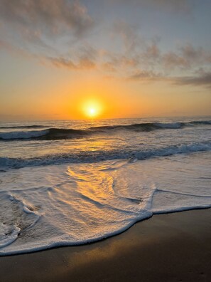 On the beach, sun-loungers