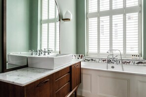 Separate bathtub and shower, hair dryer, towels, soap