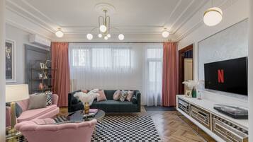 Luxury Apartment | Living area | 120-cm Smart TV with cable channels, TV, Netflix