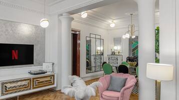 Luxury Apartment | Living area | 120-cm Smart TV with cable channels, TV, Netflix