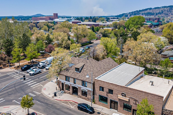 Explore the charming town of HEAD SPACE, nestled on a hillside with breathtaking views of distant mountains.