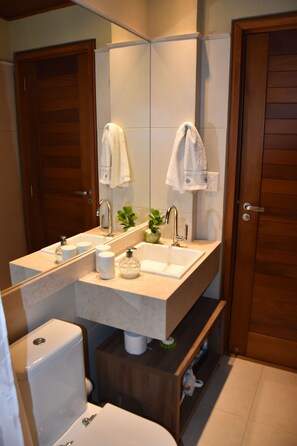 Shower, hair dryer, towels, toilet paper
