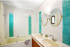 Bathtub, hair dryer, bidet, towels