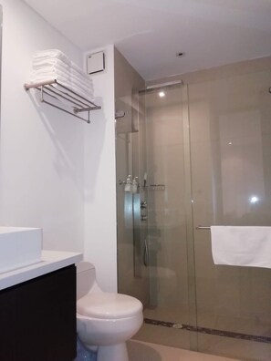 Shower, hair dryer, towels, soap