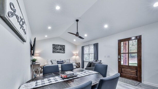 A dining area with a round table, six chairs, and a ceiling fan. - Fully Renovated Ranch Home 1/2 mi from Charming downtown Ball Ground (Ball Ground)