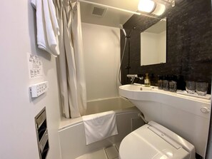 Hair dryer, slippers, bidet, towels