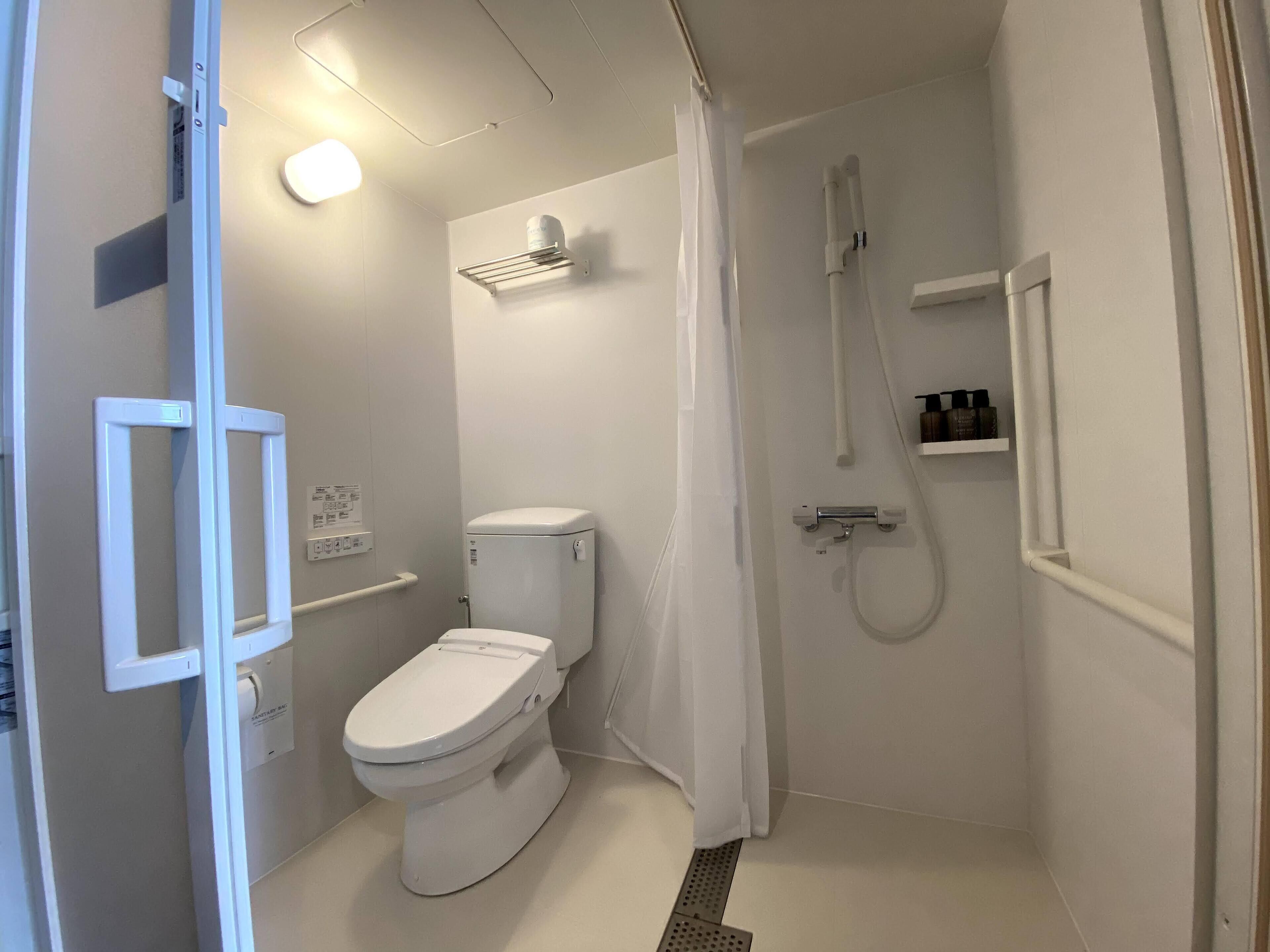 hair dryer, slippers, bidet, towels