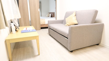 Deluxe Room (2 Double Beds, 1 Sofa Bed, Kitchen, Non-Smoking) | 1 bedroom, desk, free WiFi, bed sheets