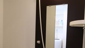 Combined shower/tub, free toiletries, hair dryer, slippers