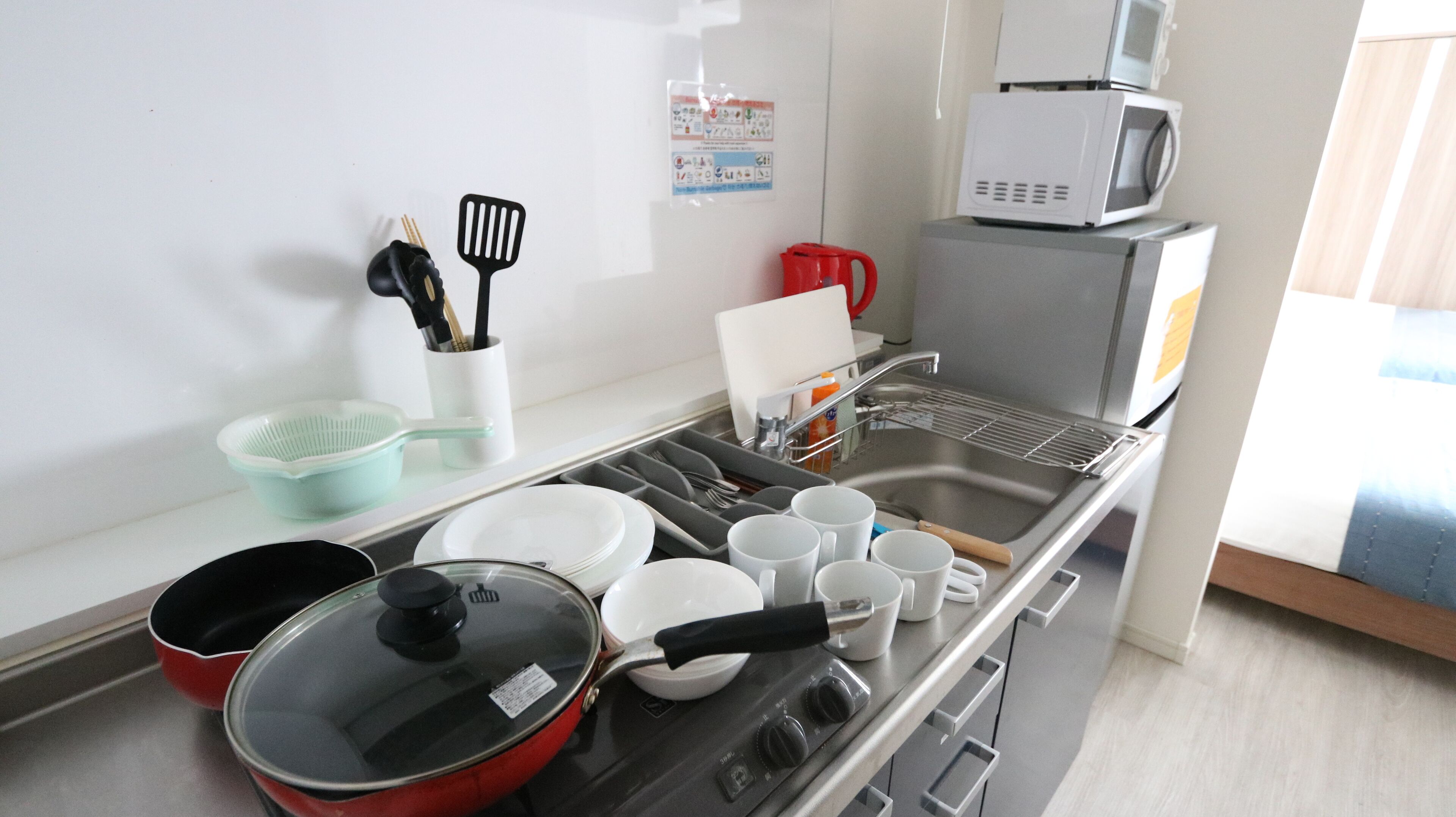 Fridge, microwave, stovetop, cookware/dishes/utensils