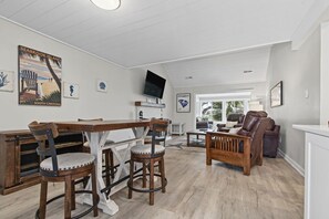 The raised dining table sits just inside the front door.  Plenty of room for 6 to dine or play a family game!