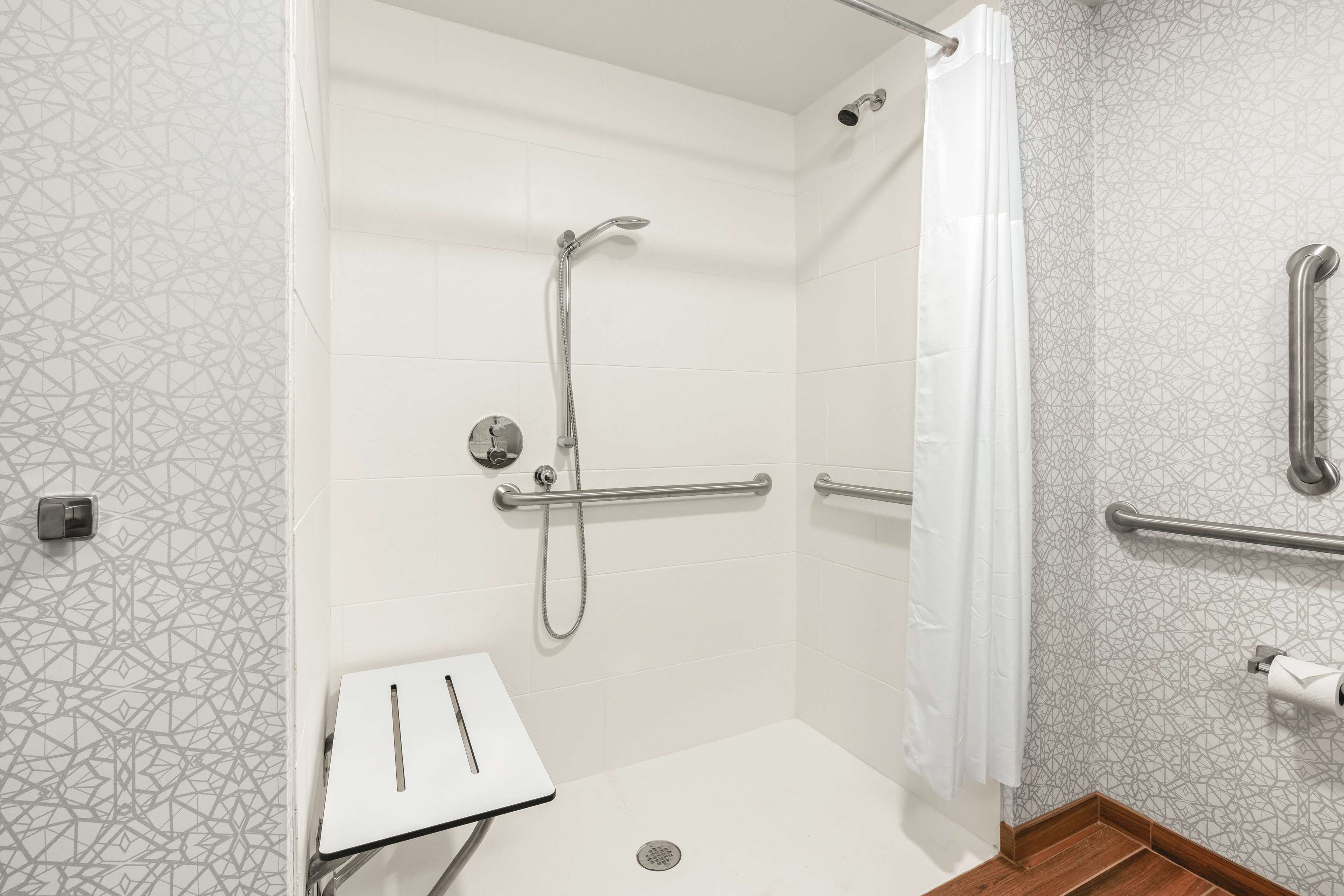 room, 1 king bed, accessible (roll-in shower, mobility & hearing) | bathroom | rainfall showerhead, hair dryer, towels
