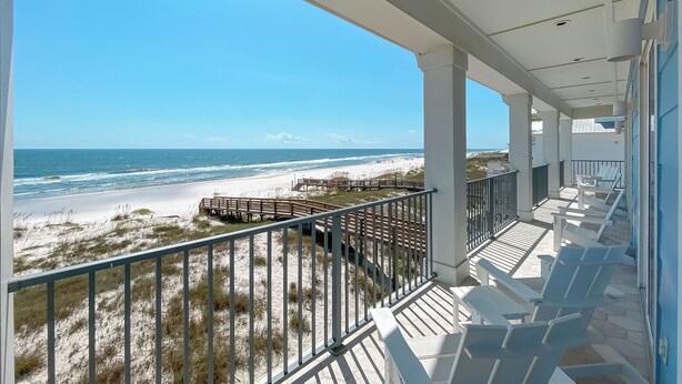 A balcony with a view of the beach and ocean. - Another Round by GSVR | Beachfront w/ Pool & Elevator | Free Activities/Golf (Gulf Shores)