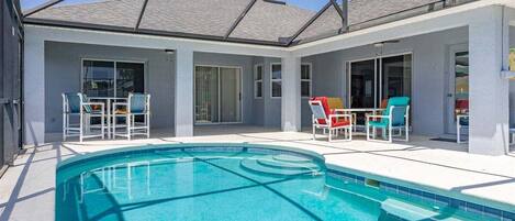 A heated pool, sun loungers