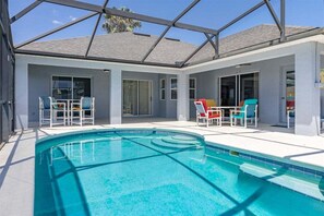 A heated pool, sun loungers