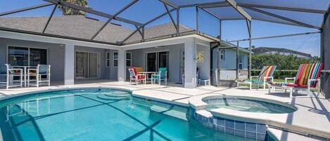 A heated pool, sun loungers