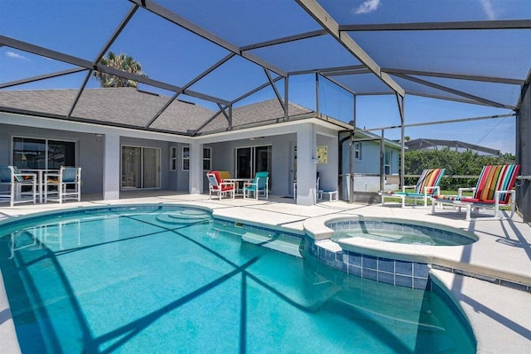 A heated pool, sun loungers