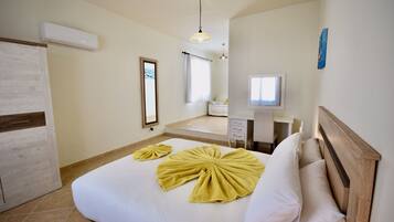 2 chambres, coffres-forts dans les chambres, fer et planche Ă repasser