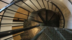 A spiral staircase with a metal railing and a textured floor. - Peaceful and Private - Luxury Self Catering Home in Lanseria (Lanseria)