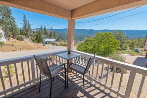 Enjoy a peaceful outdoor space with a deck overlooking the surrounding mountains.