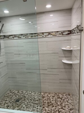 Shower, towels, soap, toilet paper