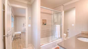 Combined shower/tub, hair dryer, towels, soap