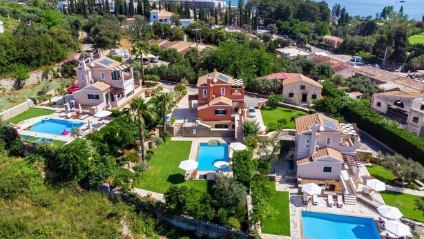 A residential area with multiple houses, each featuring a swimming pool and lush greenery. - Jasmine Luxury Villa With Private Pool (Corfu)