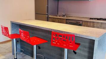 Fridge, microwave, stovetop, coffee/tea maker