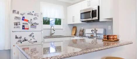 Coffee/tea maker, fridge, microwave, oven