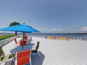 Enjoy the ocean view from this seaside terrace with comfortable seating and a clear view of the sea.