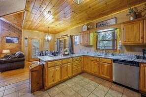 Enjoy cooking in this well-equipped kitchen with a dishwasher and dining area.