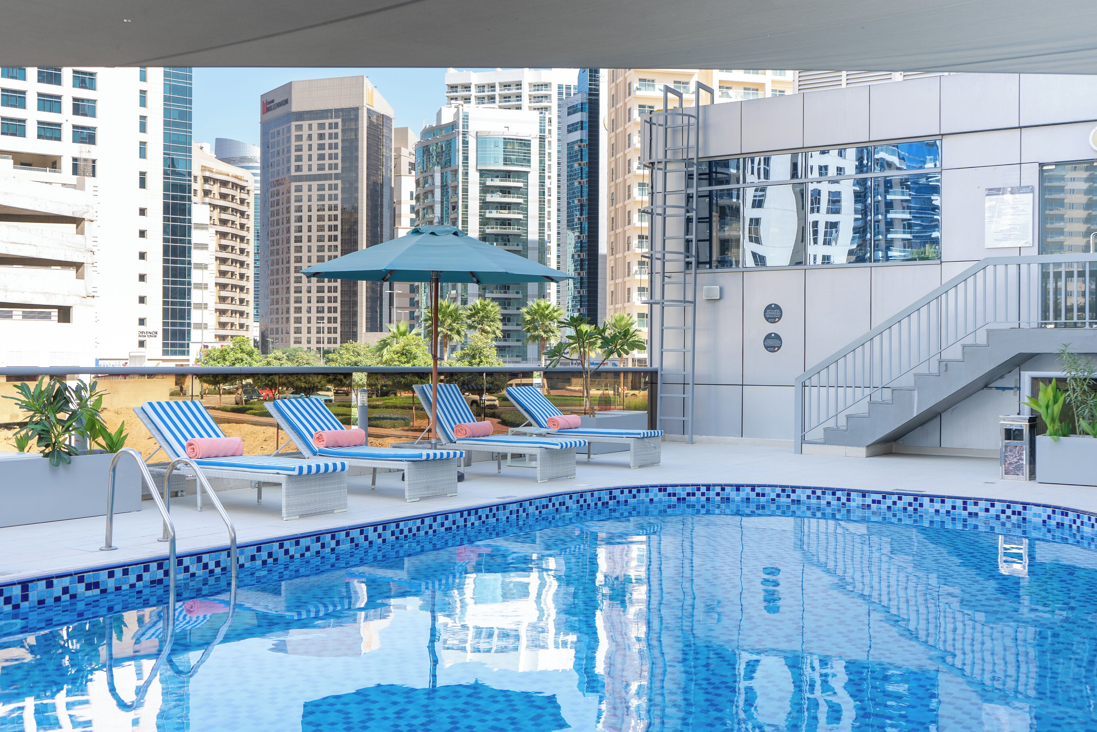 Outdoor pool, open 7:00 AM to 9:00 PM, pool loungers