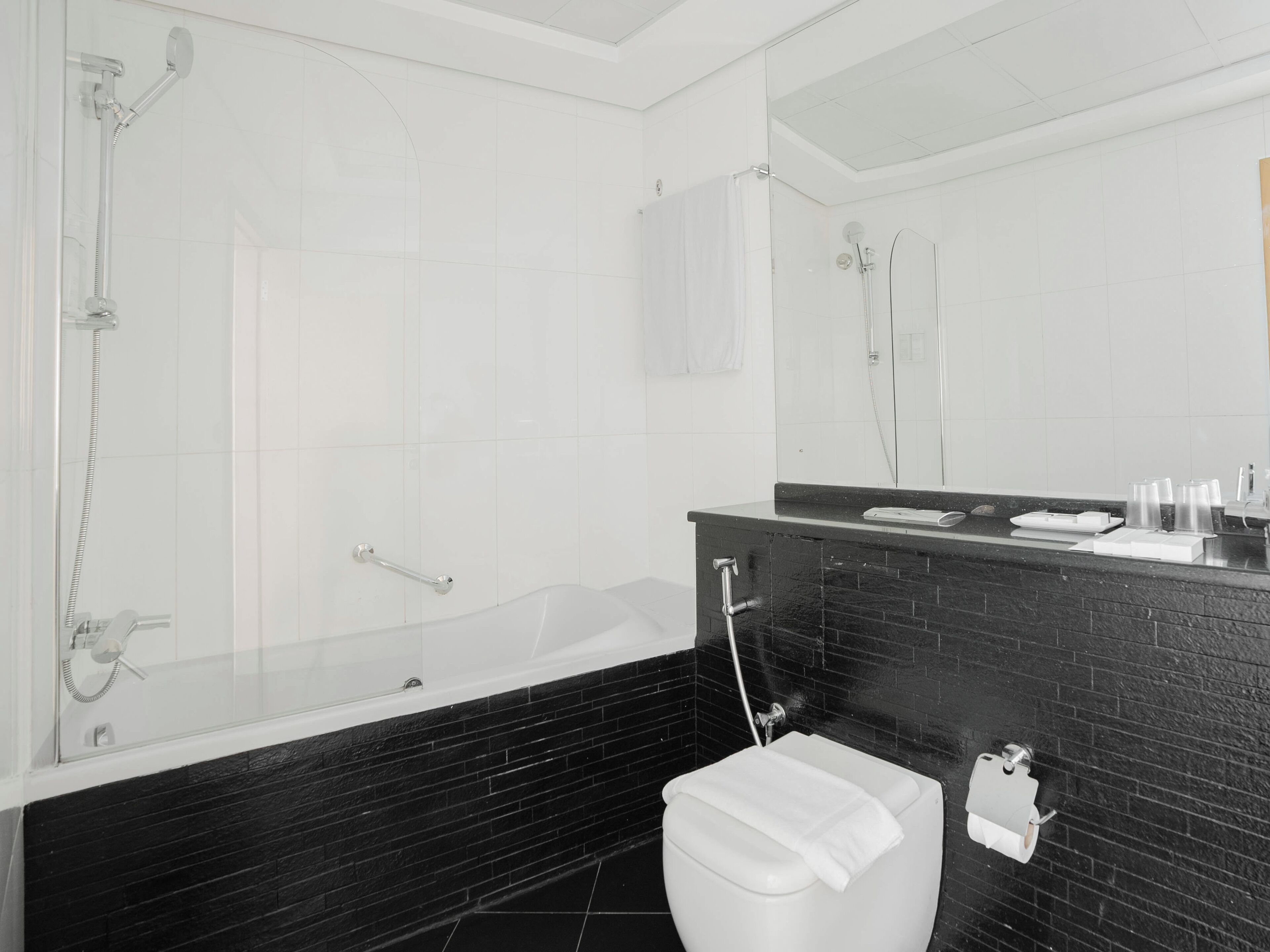 bathtub, free toiletries, hair dryer, slippers