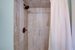 Bathtub, hair dryer, towels, soap
