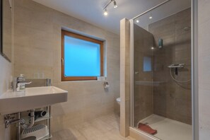 Bathtub, hair dryer, towels, soap
